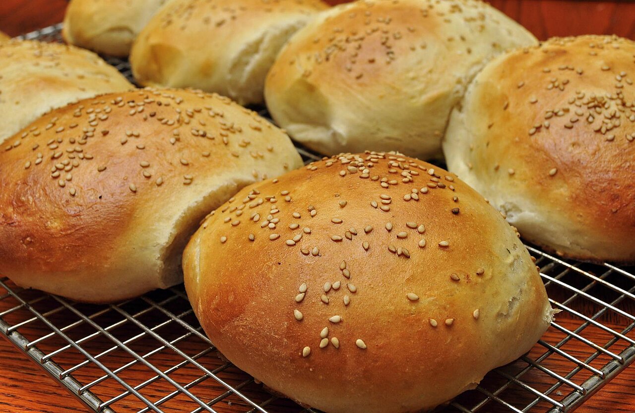 Fresh artisan breads arranged on a bakery counter